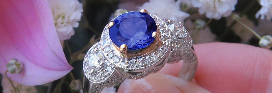 Natural, top grade, round tanzanite ring with diamond halo, ornate design, 14 karat white gold