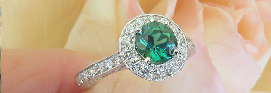 Spectacular, round, seafoam, green tourmaline, and diamond halo ring in 14 karat white gold