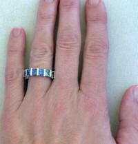 Princess cut natural rainbow sapphire eternity ring in gold