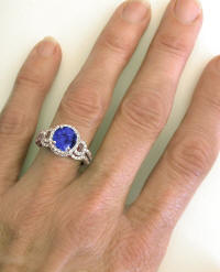 Tanzanite Engagement Ring and Wedding Band on the hand