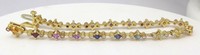 Delicate rainbow sapphire bracelet in 14k white gold, featuring vibrant sapphires from Sri Lanka and sparkling diamonds.