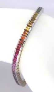 Princess cut rainbow sapphire bracelet in 14k white gold, featuring vibrant natural sapphires in a double rainbow pattern.