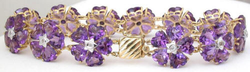 Large Amethyst Flower Tennis Bracelet with Heart Cut Gemstones in 14k yellow gold for sale