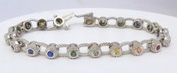 Bezel set rainbow sapphire bracelet in 14k white gold, featuring a continuous colorful design around a 7-inch wrist.