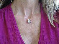 A stylish three-row diamond slide necklace in elegant 14k white gold.