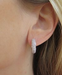 Stylish 1.0 carat diamond hoop earrings in 14k white gold with pave diamonds on front and back.