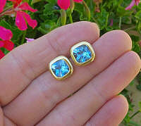 Bezel Set 5 carat Cushion Cut Blue Topaz Stud Earrings in 14k yellow gold