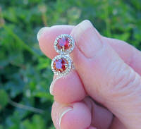 Genuine red orange sapphire and diamond stud earrings in 14 white gold