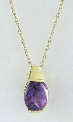 1.3 carat Buff Top Oval Amethyst Pendant in 14k yellow gold 