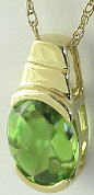 Oval Cut Peridot Solitaire Pendants in yellow gold