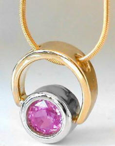 Pink Sapphire Solitaire Pendant in 14k white and yellow gold
