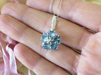 Solid White Gold Blue Topaz Flower Pendant in 14k white gold