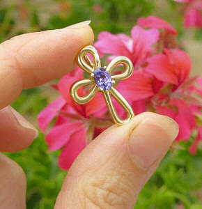 Natural Tanzanite Solitaire Cross Necklace in 14k yellow gold for sale