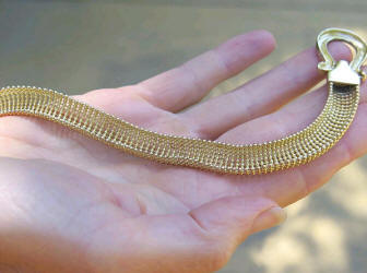 Back side of Fancy gold necklace in 14k yellow gold