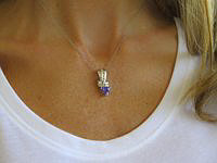 "Trilion Tanzanite and Diamond Slide Pendant in 14k white gold, featuring AAA grade tanzanite and sparkling diamonds."