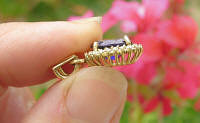 Natural Oval Iolite and Diamond Halo Pendant in 14k white gold