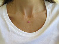 A stunning heart-cut pink sapphire pendant in 14k yellow gold.