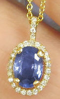 Blue Sapphire Pendant with Diamond Halo in 14k yellow gold