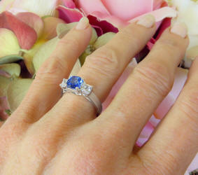 Buy a Classic Natural Blue and Princess  White Sapphire Three Stone Engagement Ring