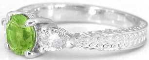 3 stone peridot ring with round peridot and pear white sapphires