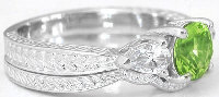 peridot 3 stone engagement ring with engraving in 14k white gold