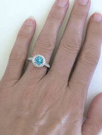 Round Blue Topaz and Round Diamond Ring in White Gold