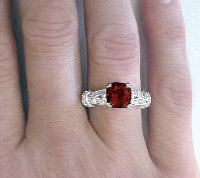 Cushion cut garnet band ring in 14k white gold