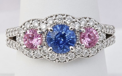 Natural round sapphire and pink sapphire ring with diamonds set in 14k white gold. Elegant and unique design.