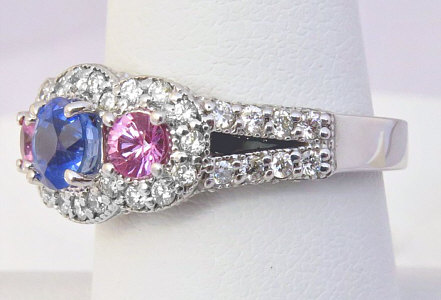 Natural round sapphire and pink sapphire ring with diamond accents in 14k white gold.