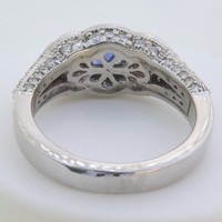 Natural round sapphire and pink sapphires set in a diamond-encrusted 14k white gold ring.