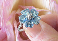 14k white gold Blue Topaz Flower Ring with Heart Cut Gemstones