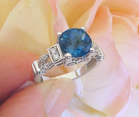 Round London Blue Topaz and Diamond Ring in 14k white gold for sale