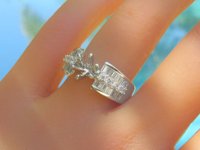 A stunning 1 carat Baguette and Round Diamond Semi Mount Ring in 18k white gold.