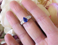 Pear Ceylon Blue Sapphire and Channel Set Real Baguette Diamond Engagement Ring in 14k white gold for sale