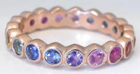 Bezel round natural rainbow sapphire eternity ring in platinum