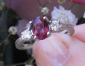 Oval Rhodolite Garnet and White Sapphire Three Stone Engagement Ring with Engraving in real 14k white gold for sale