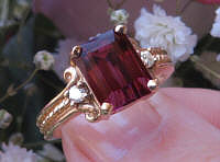 Buy a Large Emerald Cut Rhodolite Garnet Ring with Rope Design in solid 14k real yellow gold for sale