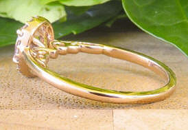 Side veiw ornate detaiiing of 14k Rose Gold Oval Natural Pink Sapphire Ring