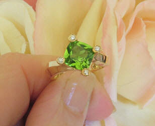 Unique Diagonal Set Peridot Ring in real 14k yellow gold mounting with Diamonds in the prongs