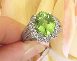 Oval Natural Peridot and Real Diamond Halo Ring with Split Shank 14k white gold mounting for sale