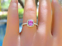 A stunning Natural Hot Pink Sapphire Ring with Diamond Halo in 14k White Gold, showcasing a vibrant pink sapphire surrounded by sparkling diamonds.