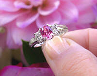 Oval natural pink sapphire three stone engagement ring with real oval diamonds in a solid 14k white gold band