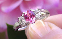 Natural oval pink sapphire and real oval diamond ring in a 14k white gold band