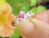 Classic Oval Natural Oval Pink Sapphire Engagement Ring with Round White Sapphires set in 14k yellow gold
