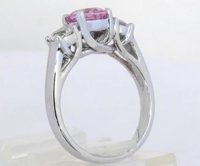 A stunning 2.31 ctw Ceylon Pink and White Sapphire Three Stone Ring in 18k white gold, symbolizing love and elegance.