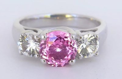Pink and white sapphire three stone ring in 18k white gold, showcasing vibrant elegance and timeless beauty.