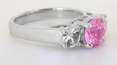 A stunning 2.31 ctw Ceylon Pink and White Sapphire Three Stone Ring in 18k white gold, symbolizing love and elegance.