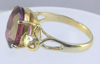 Large oval natural pink tourmaline solitaire ring in 14k yellow gold