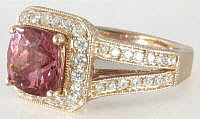 Cushion cut halo pink tourmaline ring in gold