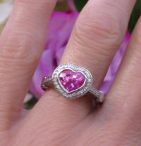Heart Shape Gem Quality Natural Pink Sapphire wedding Ring with a Diamond Halo in solid 18k white gold for sale